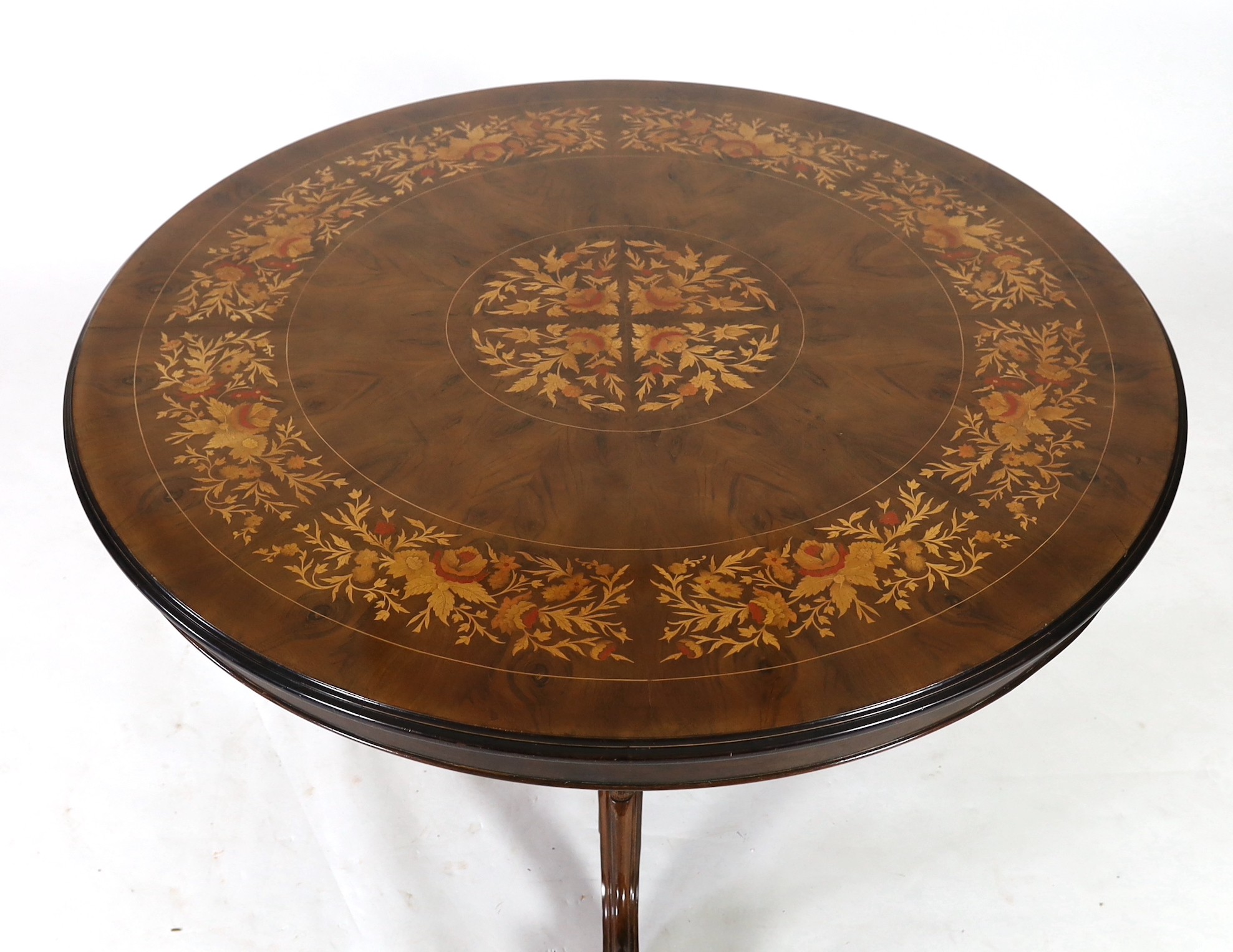A Victorian style walnut and marquetry breakfast table